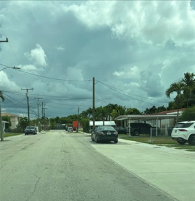 Phot of SW 25 Street roadway in need of repair