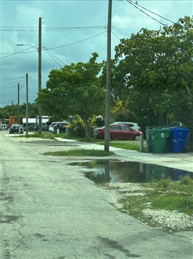 Photo of SW 25 Street roadway I need of repair