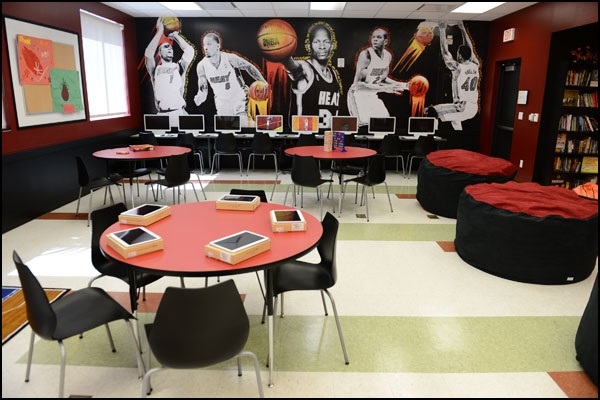 classroom with computers and basketball mural